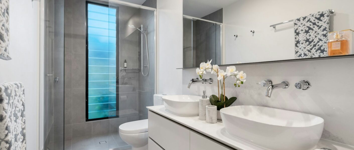 white ceramic sink with mirror