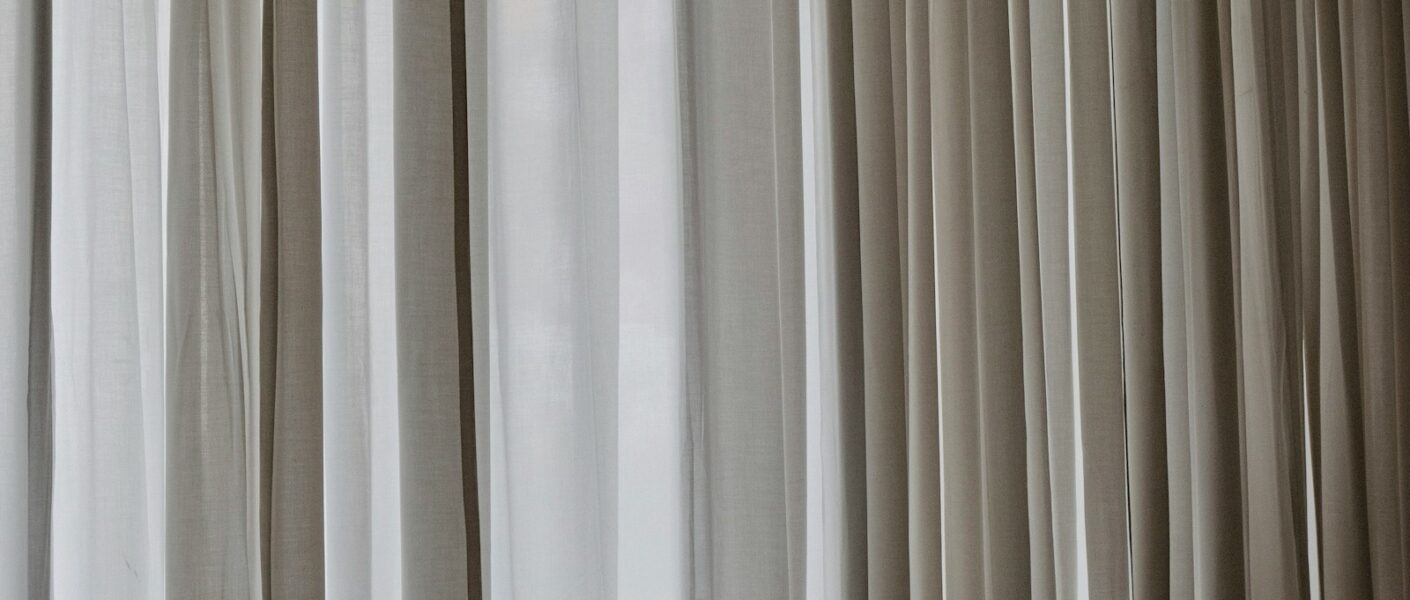 white and gray window curtain