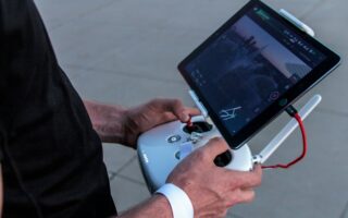 person holding quadcopter controller