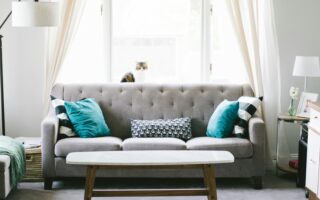 brown and white wooden table beside sofa chair