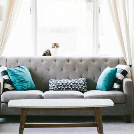 brown and white wooden table beside sofa chair